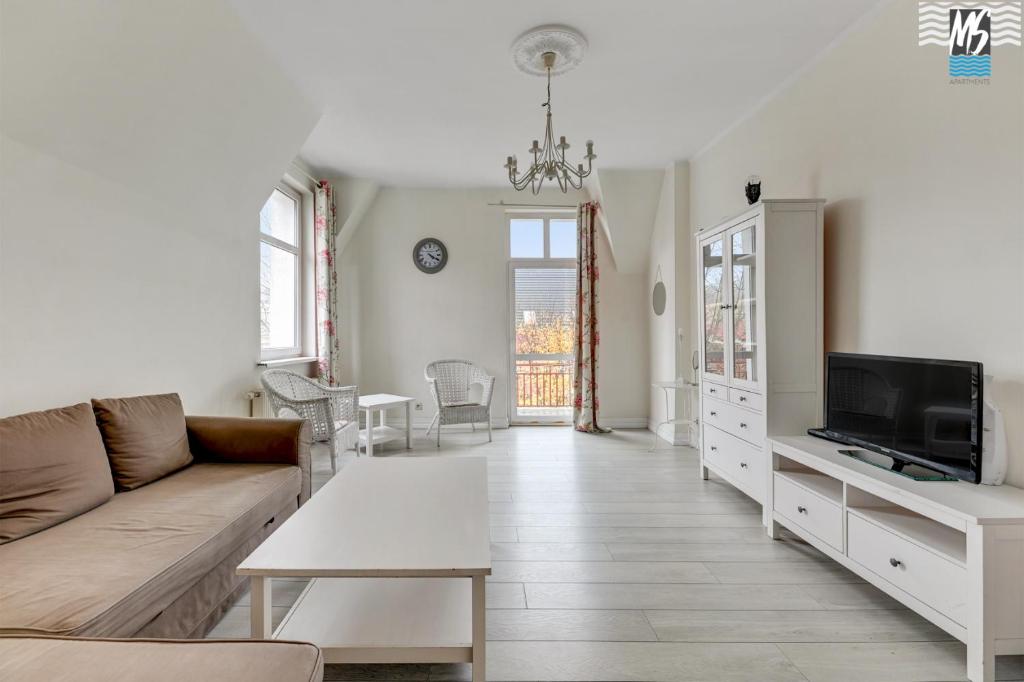 Televízia a/alebo spoločenská miestnosť v ubytovaní MS Apartments SopotForSix