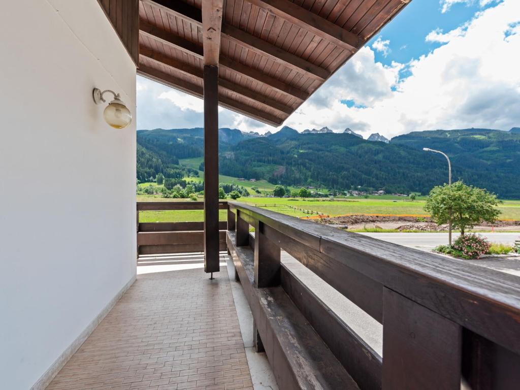 a balcony of a house with a view of the mountains at Belvilla by OYO Fiamme Grande in Predazzo