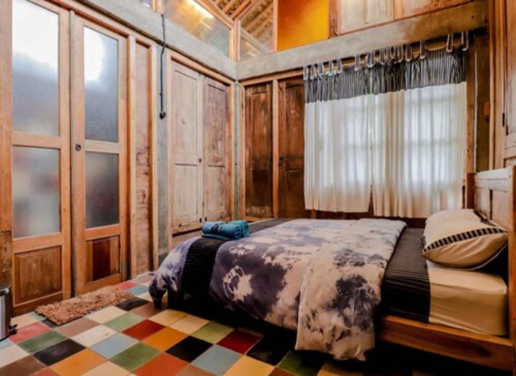 Postel nebo postele na pokoji v ubytování Lorong Homestay