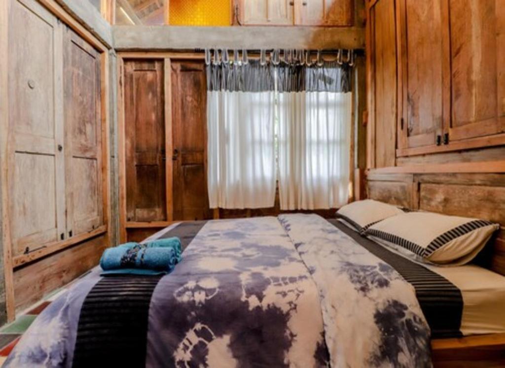 Postel nebo postele na pokoji v ubytování Lorong Homestay