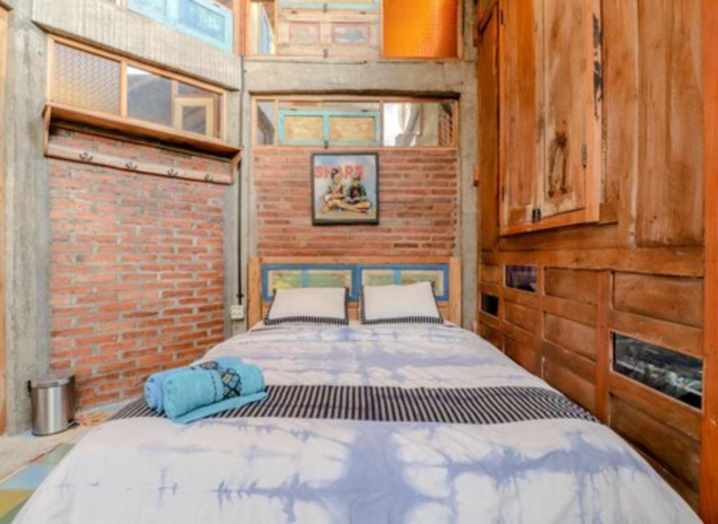 Postel nebo postele na pokoji v ubytování Lorong Homestay