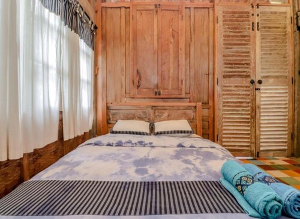 Postel nebo postele na pokoji v ubytování Lorong Homestay