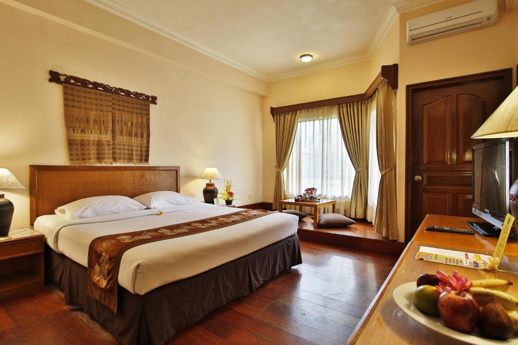 Postel nebo postele na pokoji v ubytování Jayakarta Hotel Lombok