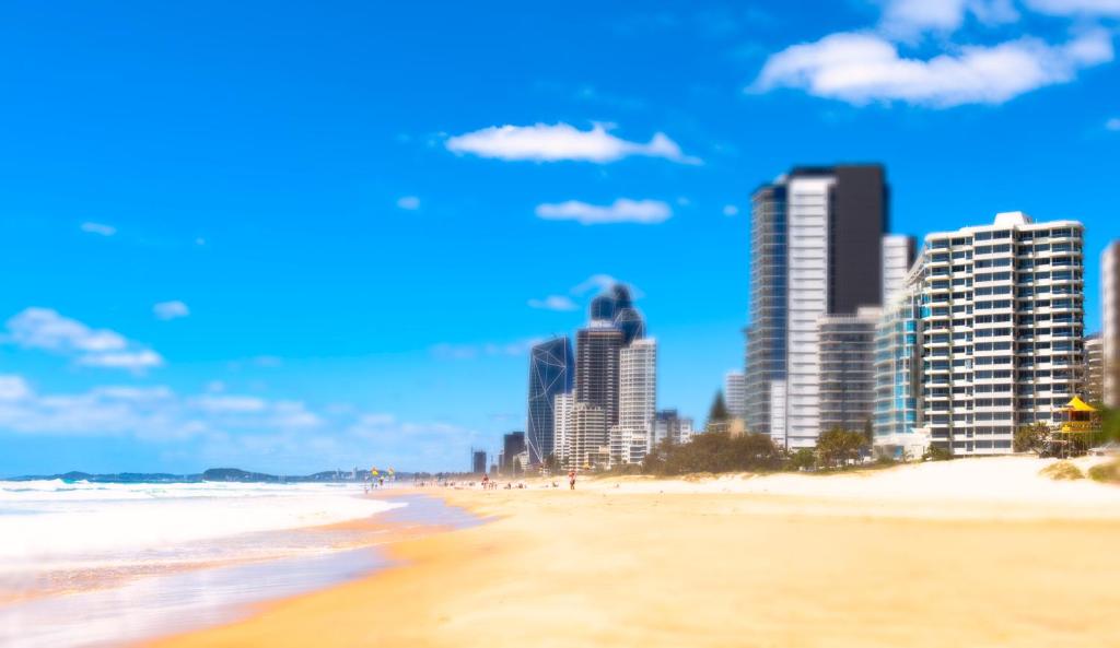 a view of a beach with tall buildings at Berkeley on the Beach in Gold Coast