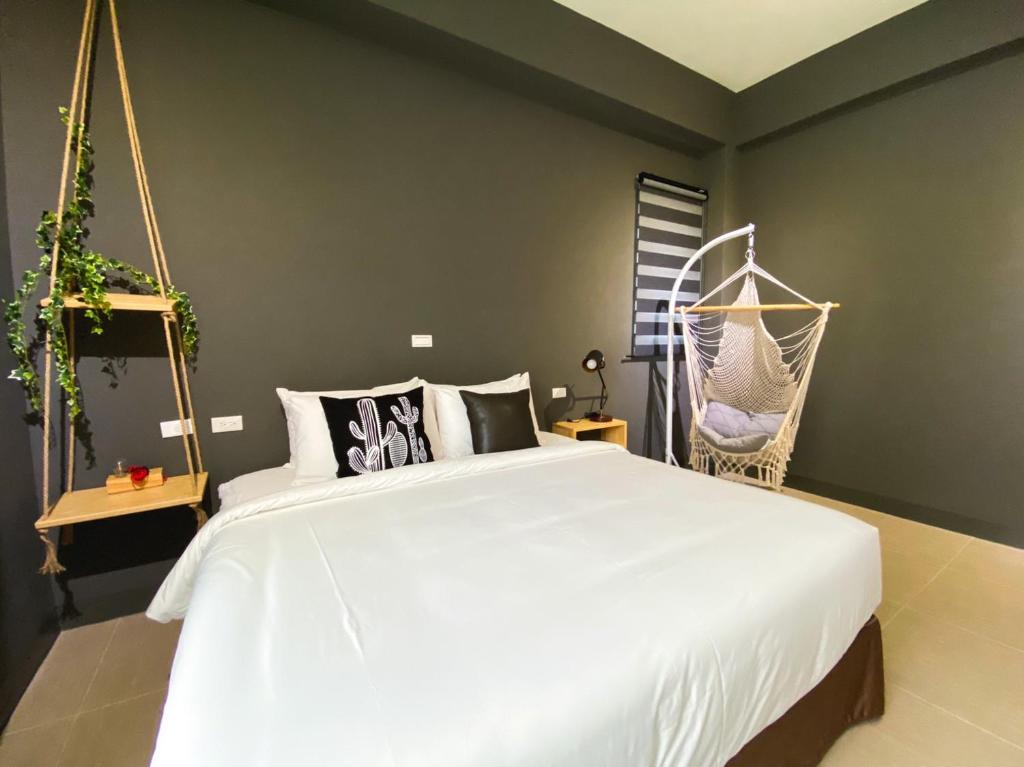 Postel nebo postele na pokoji v ubytování 禾旅宿Ho Hostel 墾丁夢幻島