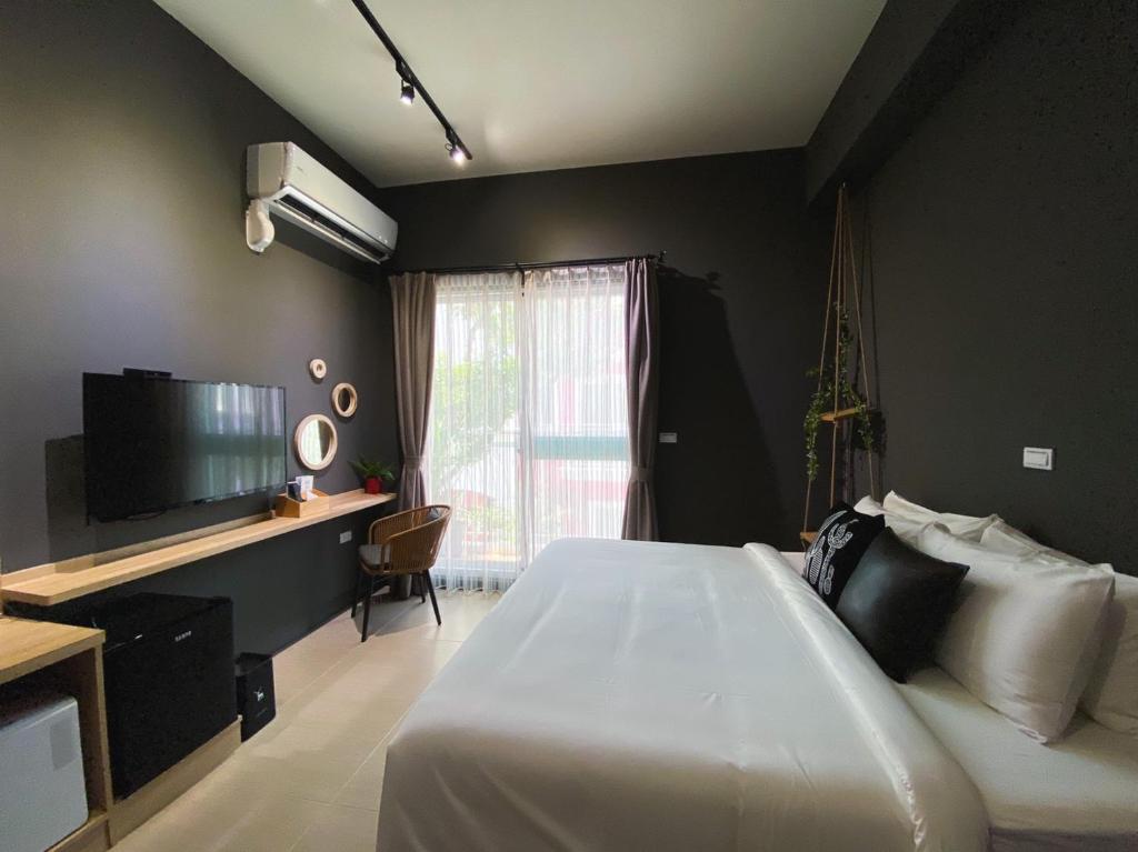 TV a/nebo společenská místnost v ubytování 禾旅宿Ho Hostel 墾丁夢幻島