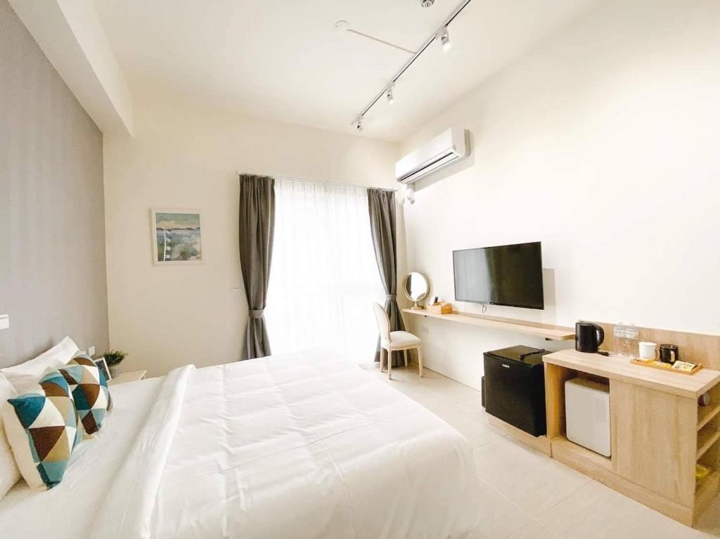 Postel nebo postele na pokoji v ubytování 禾旅宿Ho Hostel 墾丁夢幻島