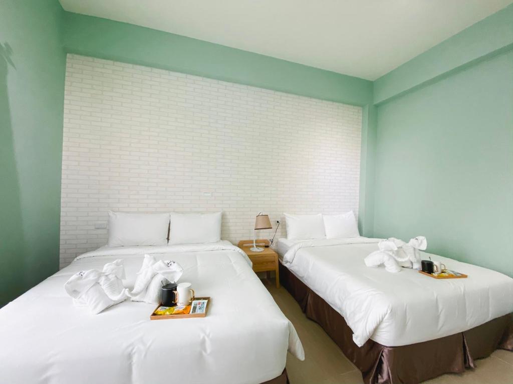 Postel nebo postele na pokoji v ubytování 禾旅宿Ho Hostel 墾丁夢幻島