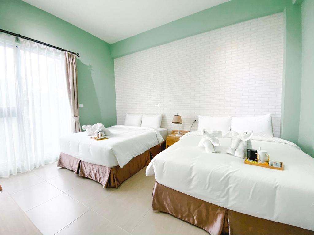 Postel nebo postele na pokoji v ubytování 禾旅宿Ho Hostel 墾丁夢幻島