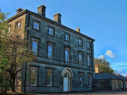 a large brick building with aventh floor at Ellison Hall in Hebburn-on-Tyne