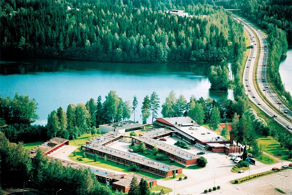 an aerial view of a building next to a lake at Finlandia Hotel Isovalkeinen in Kuopio
