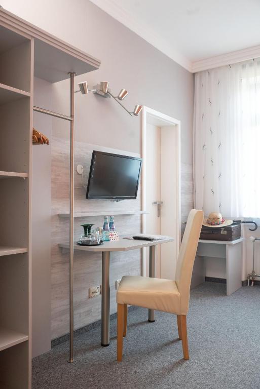 TV a/nebo společenská místnost v ubytování Hotel Adagio