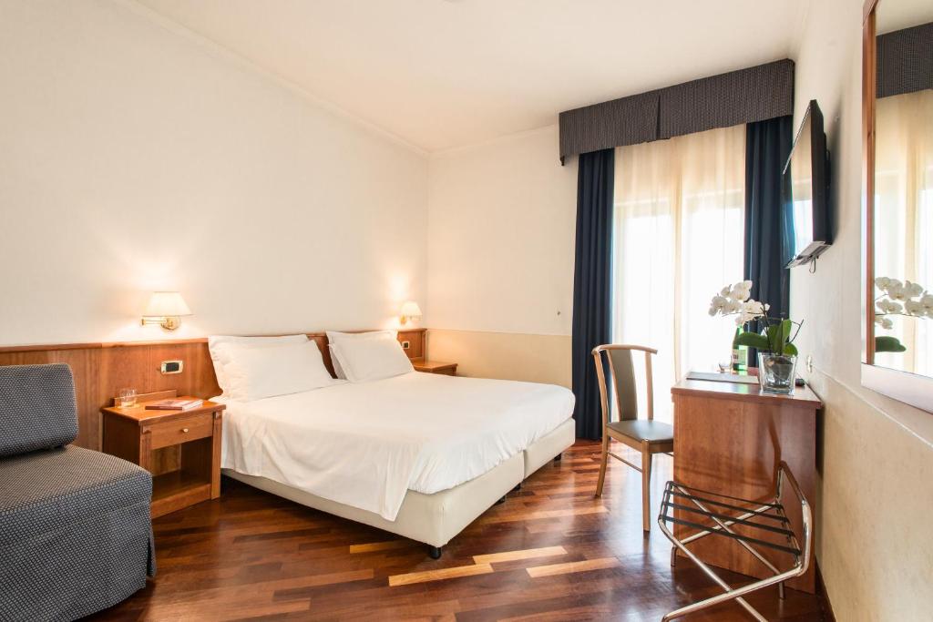 Postel nebo postele na pokoji v ubytování Atlantic Park Hotel
