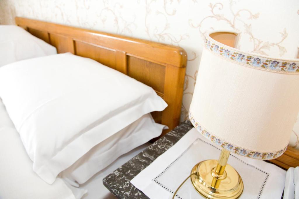 Postel nebo postele na pokoji v ubytování Hotel Villa Westend