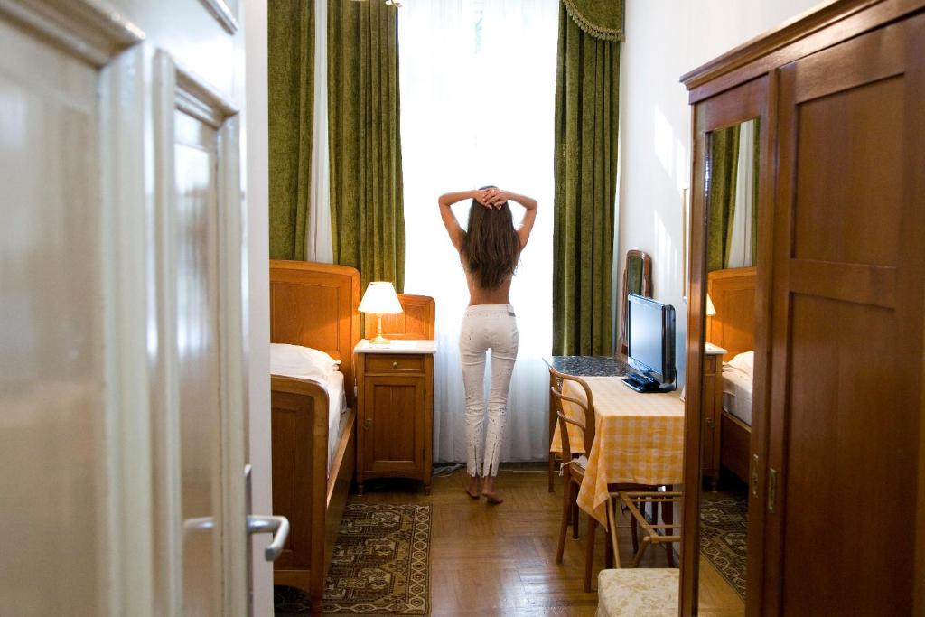 Postel nebo postele na pokoji v ubytování Hotel Villa Westend