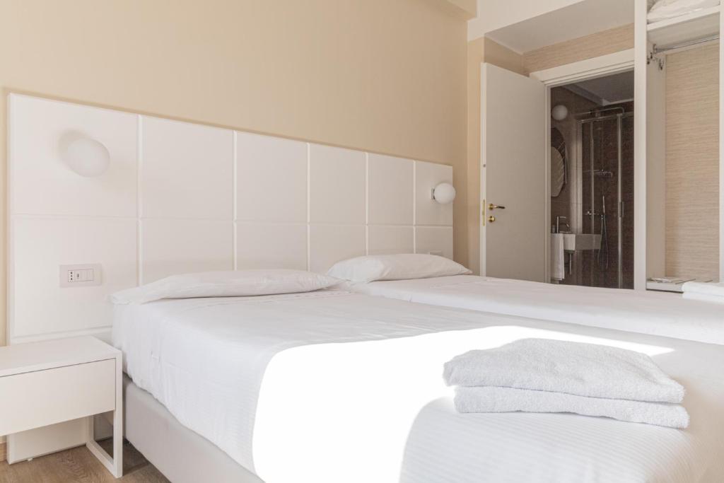 Postel nebo postele na pokoji v ubytování Hotel Boston