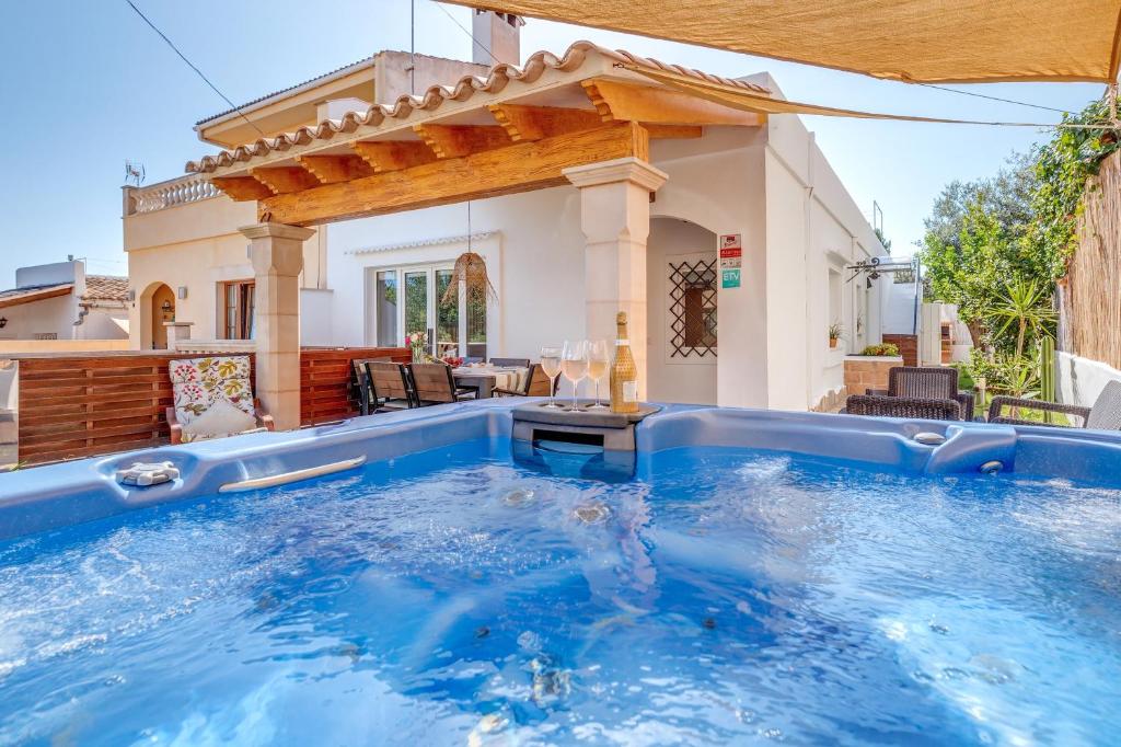 a swimming pool in the backyard of a house at Casa Mediterranea in Santa Margalida