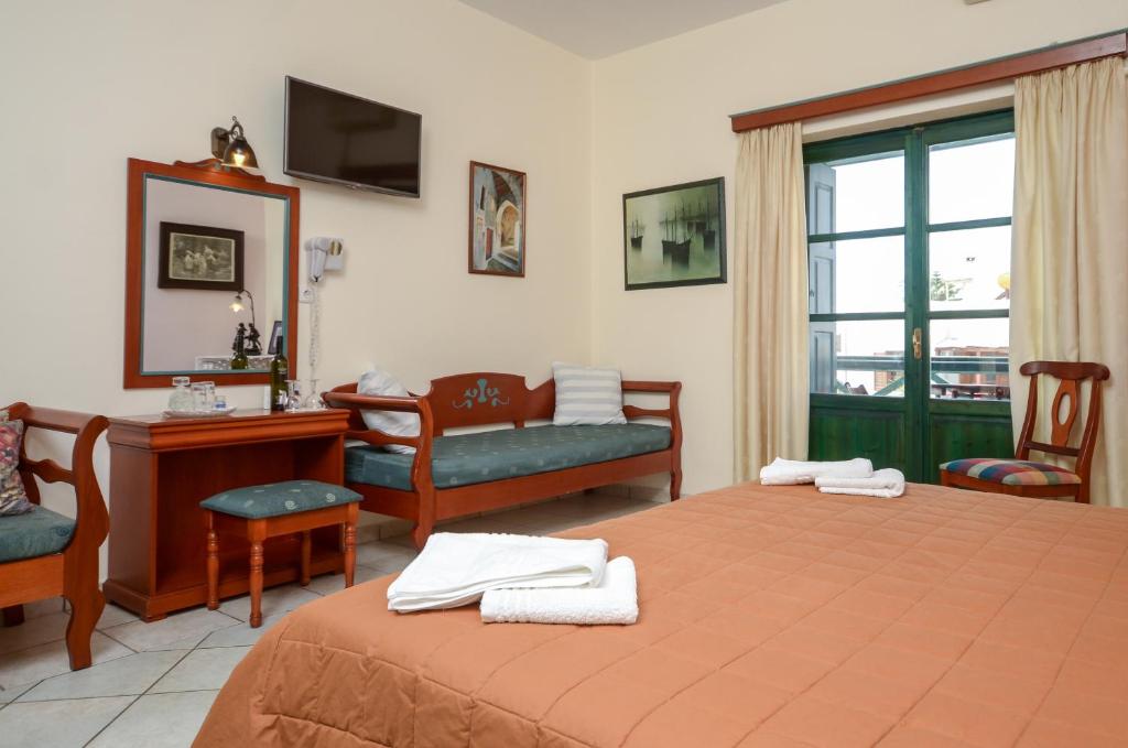 Postel nebo postele na pokoji v ubytování Apollon Hotel