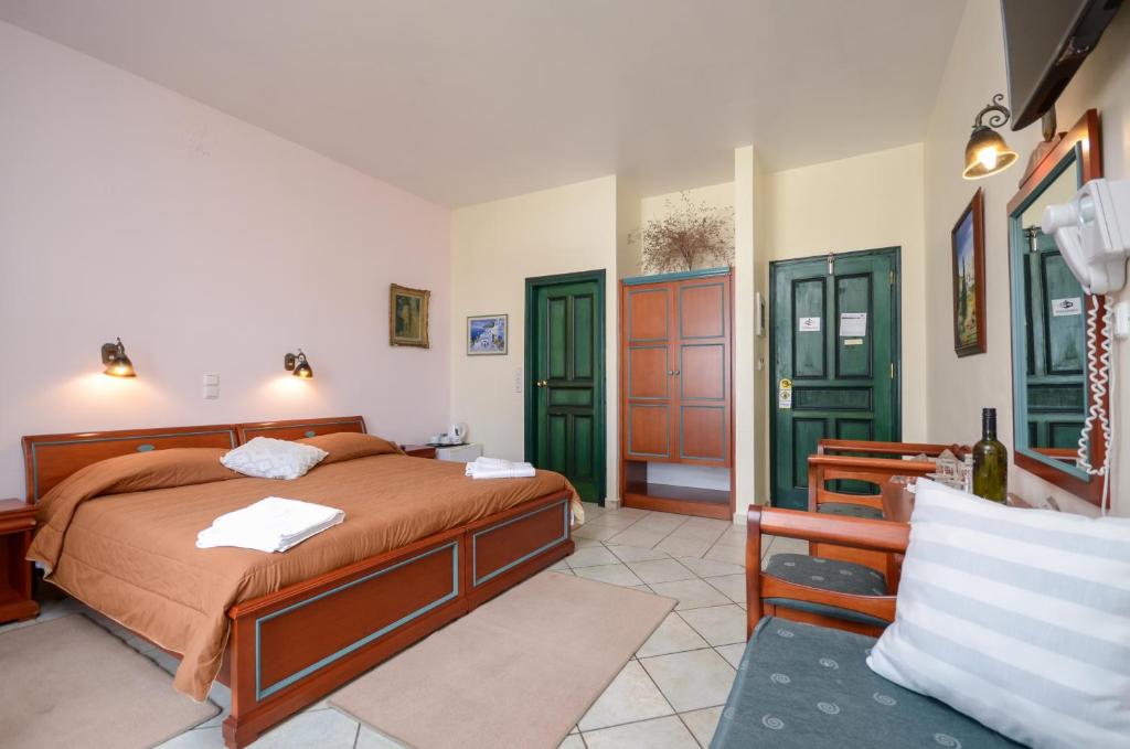 Postel nebo postele na pokoji v ubytování Apollon Hotel