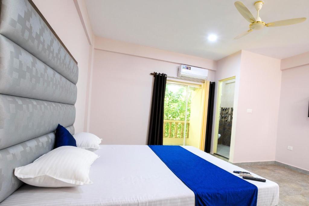 Postel nebo postele na pokoji v ubytování Casa Da Village Calangute Goa