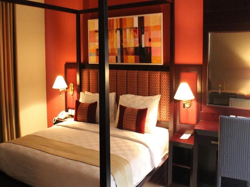Postel nebo postele na pokoji v ubytování Le Dian Hotel