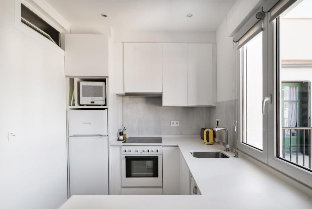 Kuchyň nebo kuchyňský kout v ubytování Apartamento Ecléctico en el centro de la ciudadAC