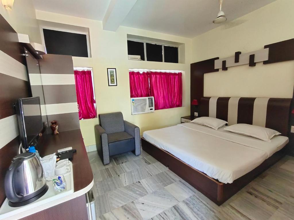 Postel nebo postele na pokoji v ubytování Hotel Gandhara
