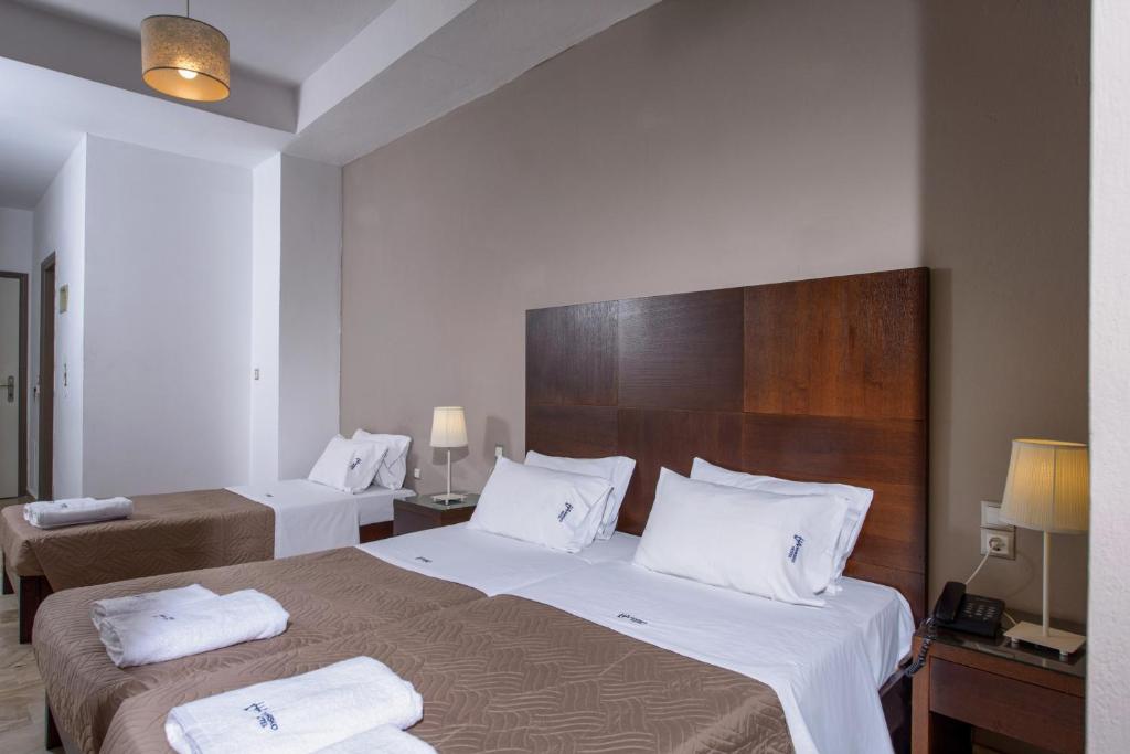 Postel nebo postele na pokoji v ubytování Vanisko Hotel