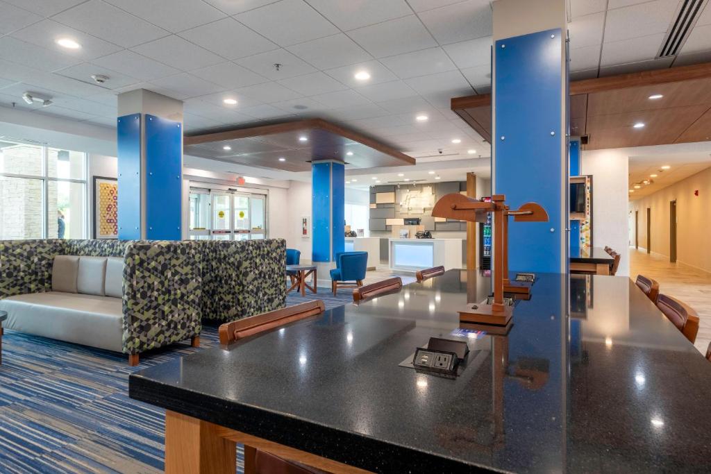 a lobby of a hospital with a waiting room at Holiday Inn Express & Suites - Staunton, an IHG Hotel in Staunton