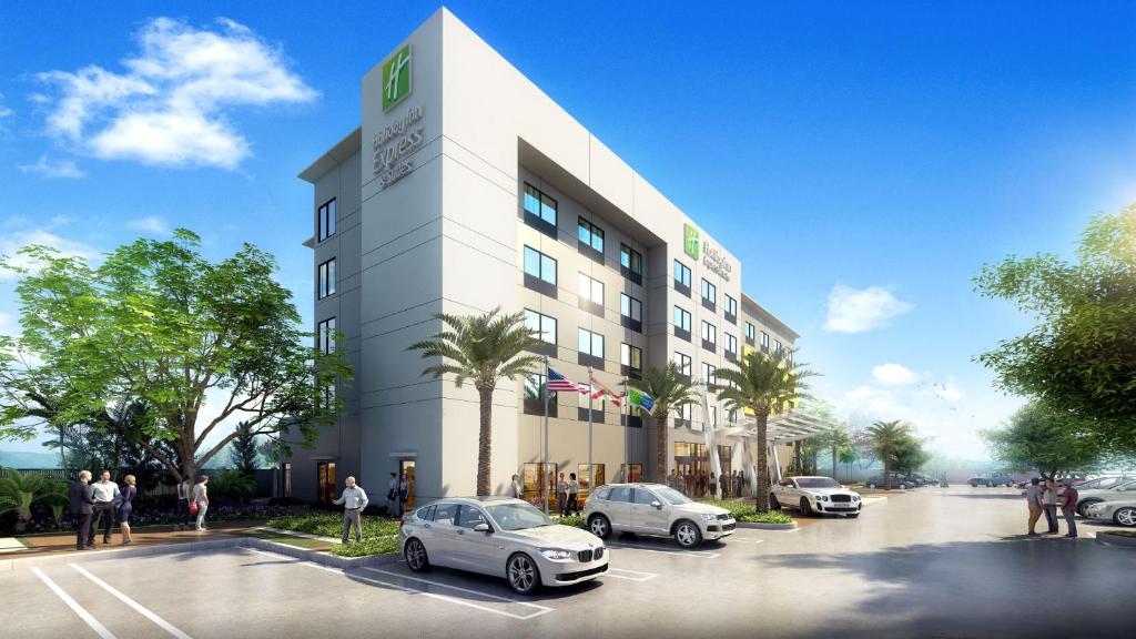 a rendering of a building with cars parked in a parking lot at Holiday Inn Express Doral Miami, an IHG Hotel in Doral