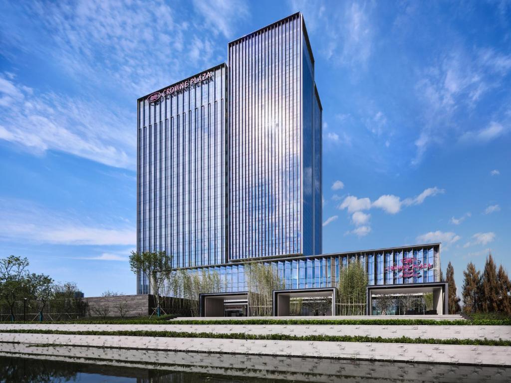 a rendering of a tall building with a sky at Crowne Plaza Qidong by IHG in Qidong