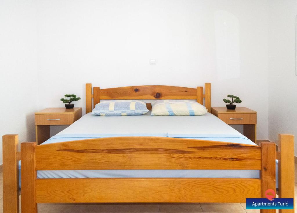 Posteľ alebo postele v izbe v ubytovaní Apartments Turić