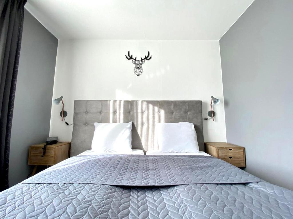 Postel nebo postele na pokoji v ubytování Hotel De Fierlant