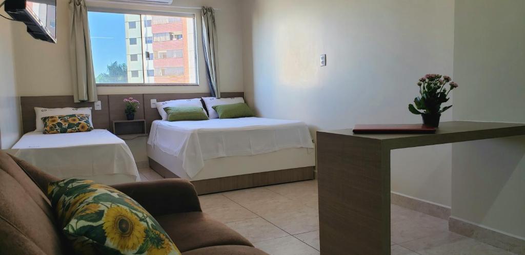 Postel nebo postele na pokoji v ubytování Infinity Hotel