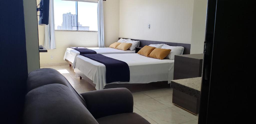 Postel nebo postele na pokoji v ubytování Infinity Hotel