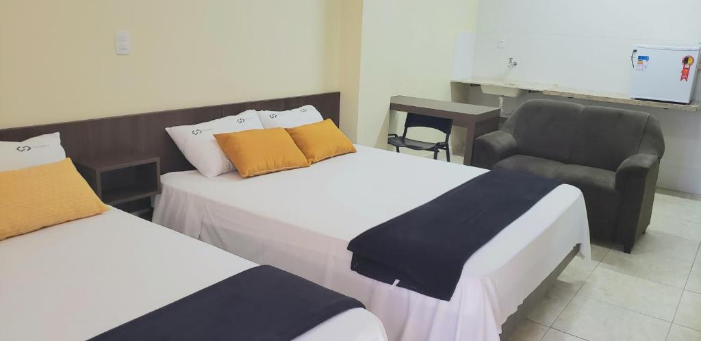 Postel nebo postele na pokoji v ubytování Infinity Hotel