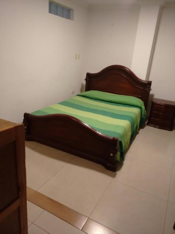 Postel nebo postele na pokoji v ubytování Hotel Ejecutivo Imperial
