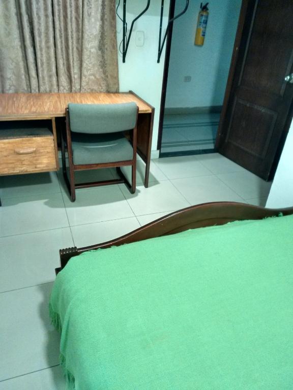 Postel nebo postele na pokoji v ubytování Hotel Ejecutivo Imperial
