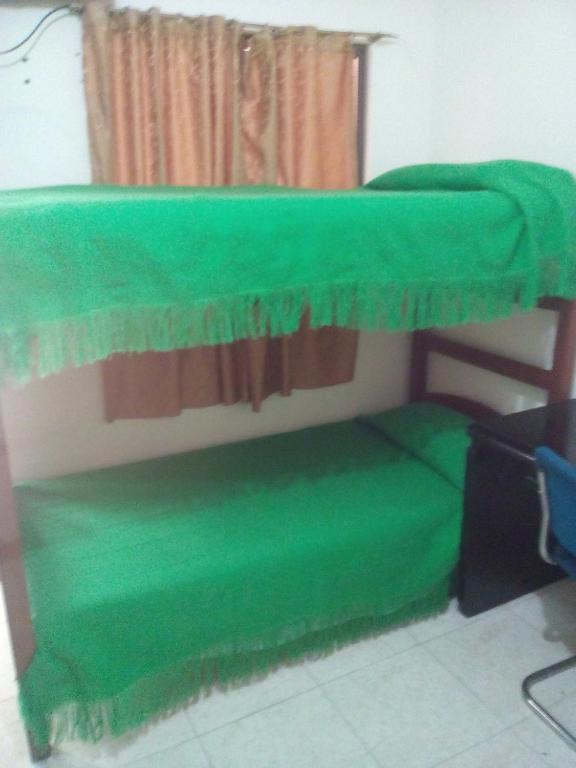Postel nebo postele na pokoji v ubytování Hotel Ejecutivo Imperial