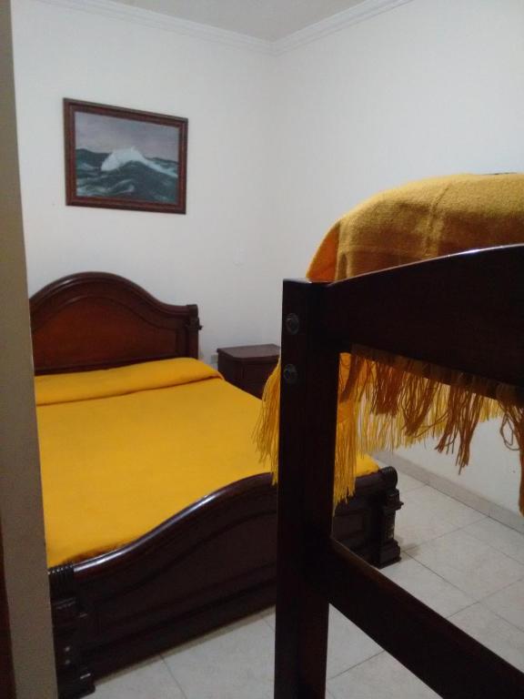 Postel nebo postele na pokoji v ubytování Hotel Ejecutivo Imperial
