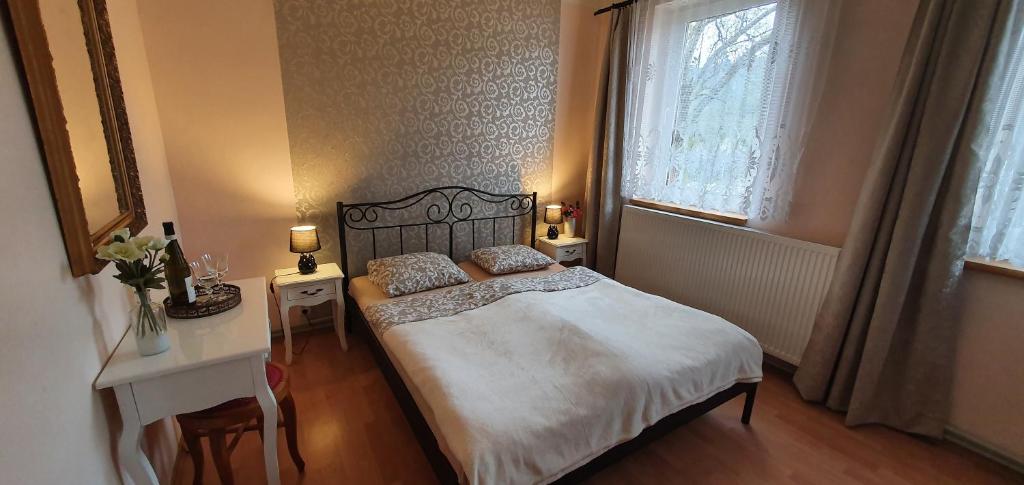 Postel nebo postele na pokoji v ubytování Lipno & Wellness Chata