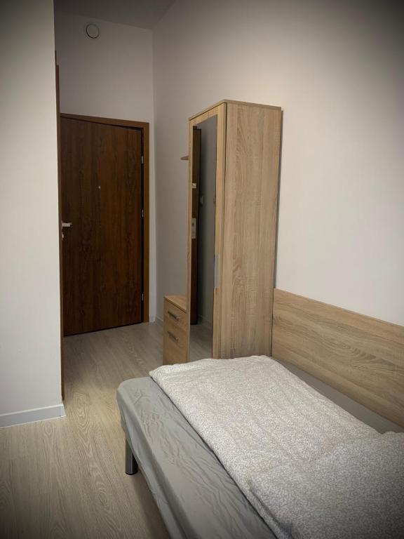 Łóżko lub łóżka w pokoju w obiekcie Hostel Sportowa