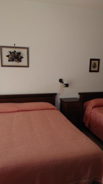 Postel nebo postele na pokoji v ubytování Agriturismo Le Viole
