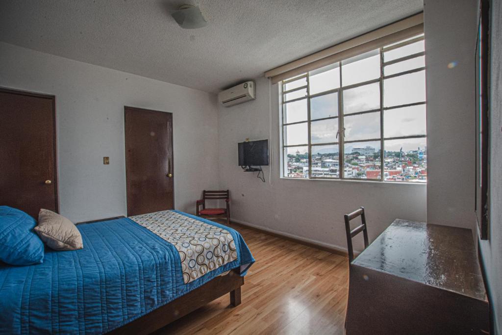 Postel nebo postele na pokoji v ubytování Hotel Palacio