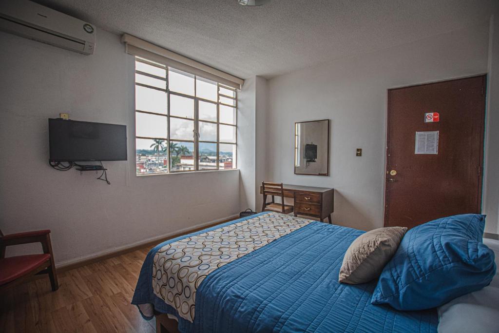 Postel nebo postele na pokoji v ubytování Hotel Palacio