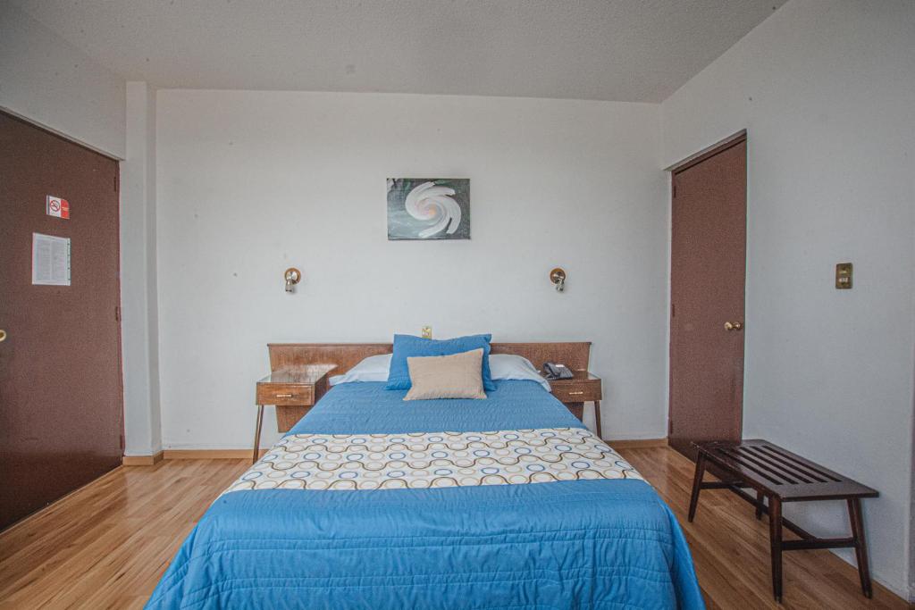 Postel nebo postele na pokoji v ubytování Hotel Palacio