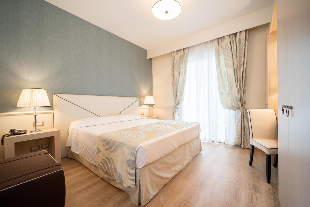 Postel nebo postele na pokoji v ubytování Hotel Ariston Molino Buja