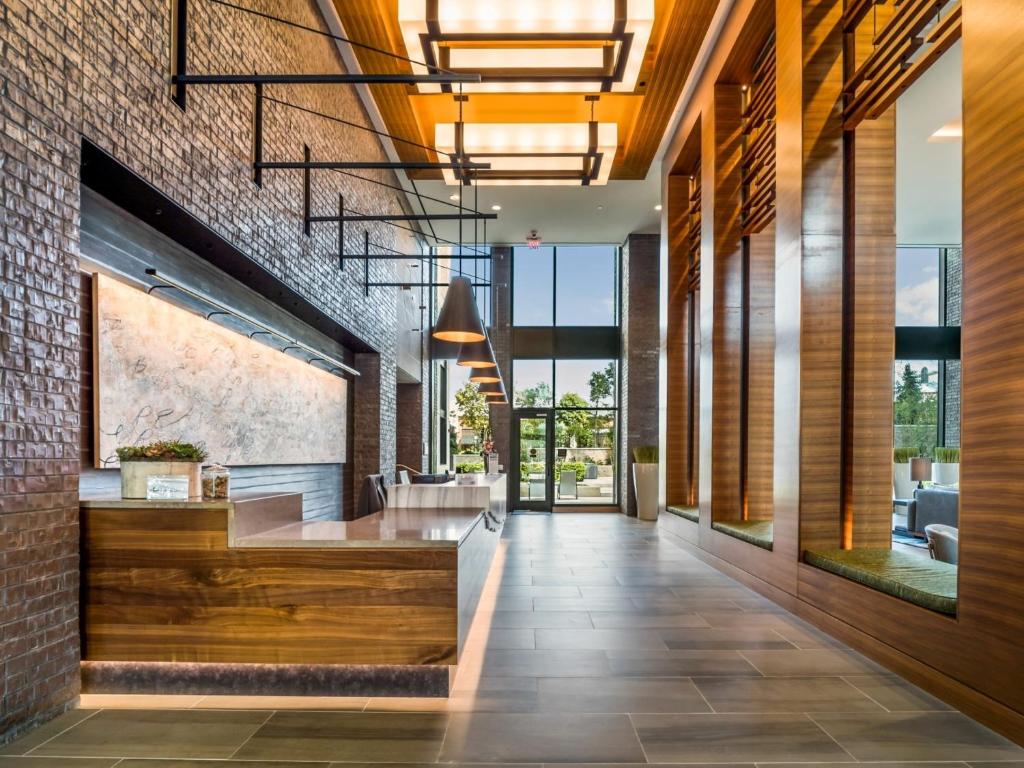 a lobby of a building with a brick wall at Bluebird Suites at Reston Town Center in Reston