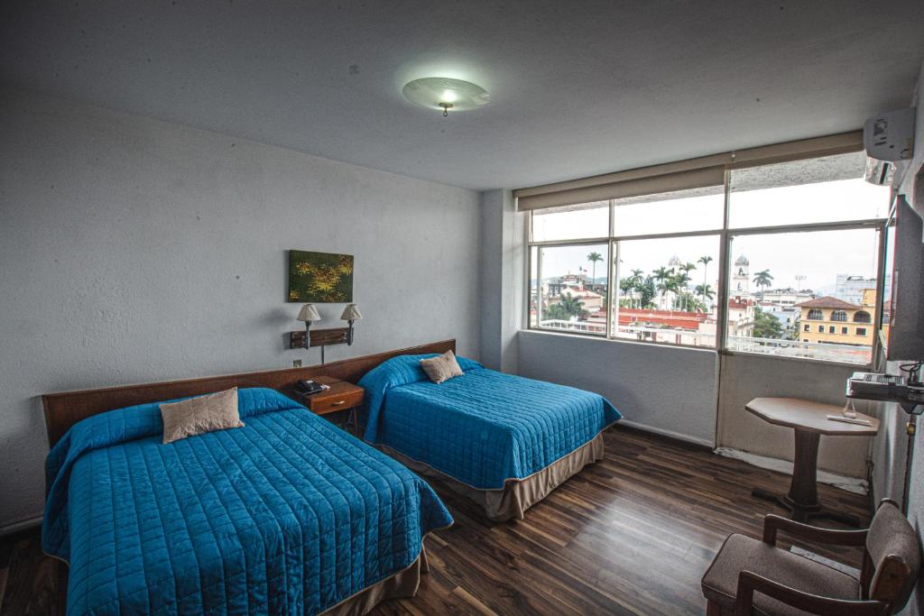 Postel nebo postele na pokoji v ubytování Hotel Palacio