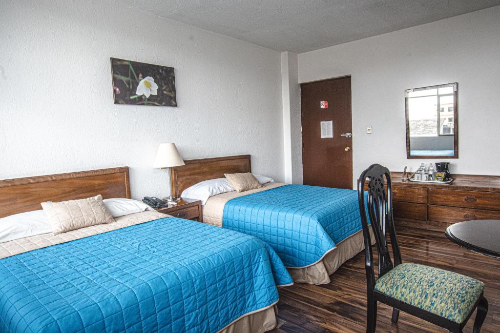 Postel nebo postele na pokoji v ubytování Hotel Palacio